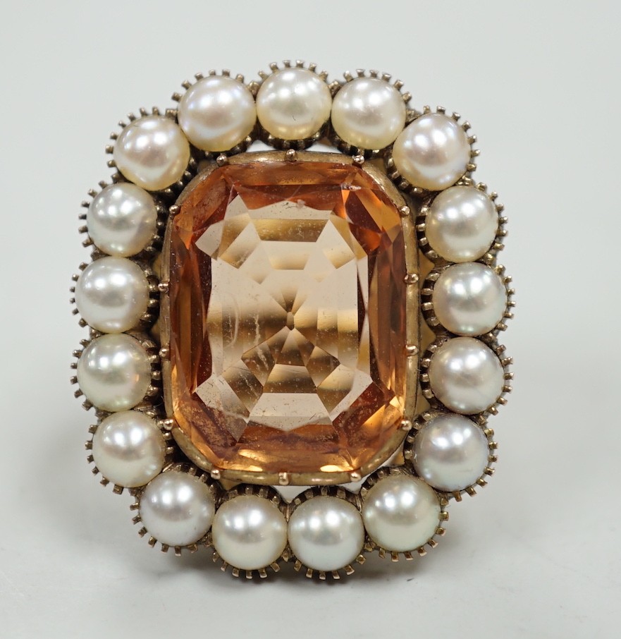 A mid 20th century gold, orange topaz and split pearl set cluster ring (adapted from an earlier brooch), size M/N, gross weight 15.7 grams.